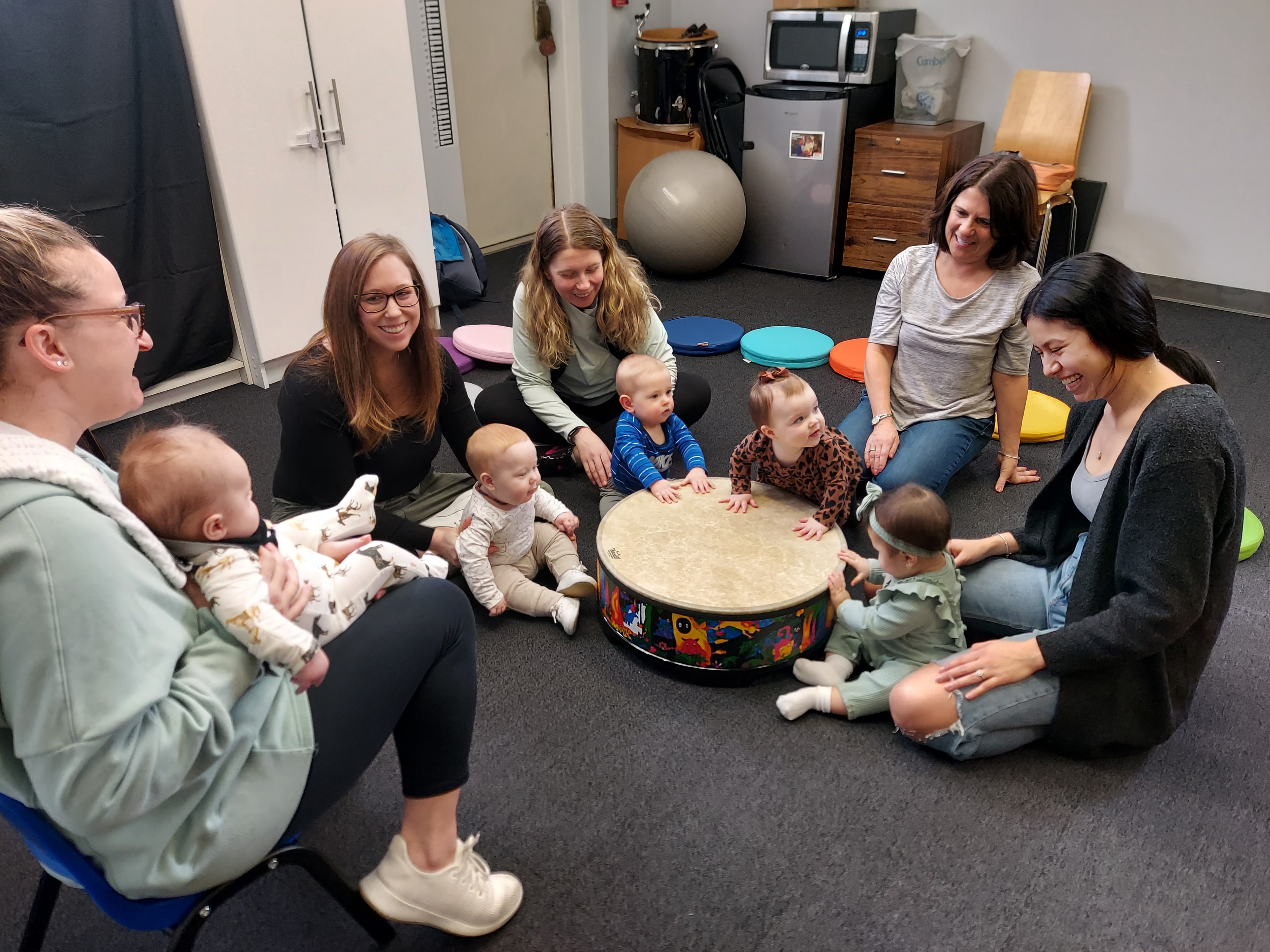 Caregiver and toddler enjoying music class together
